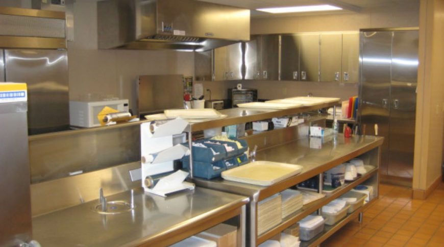 Cavalier County Memorial Hospital-Int4-1024x680-Healthcare Construction Stainless steel kitchen appliances with stainless steel counter workstations and cabinetry throughout.