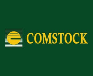 Comstock Construction's dark green and gold logo with icon on matching green background with the word "Comstock" beside