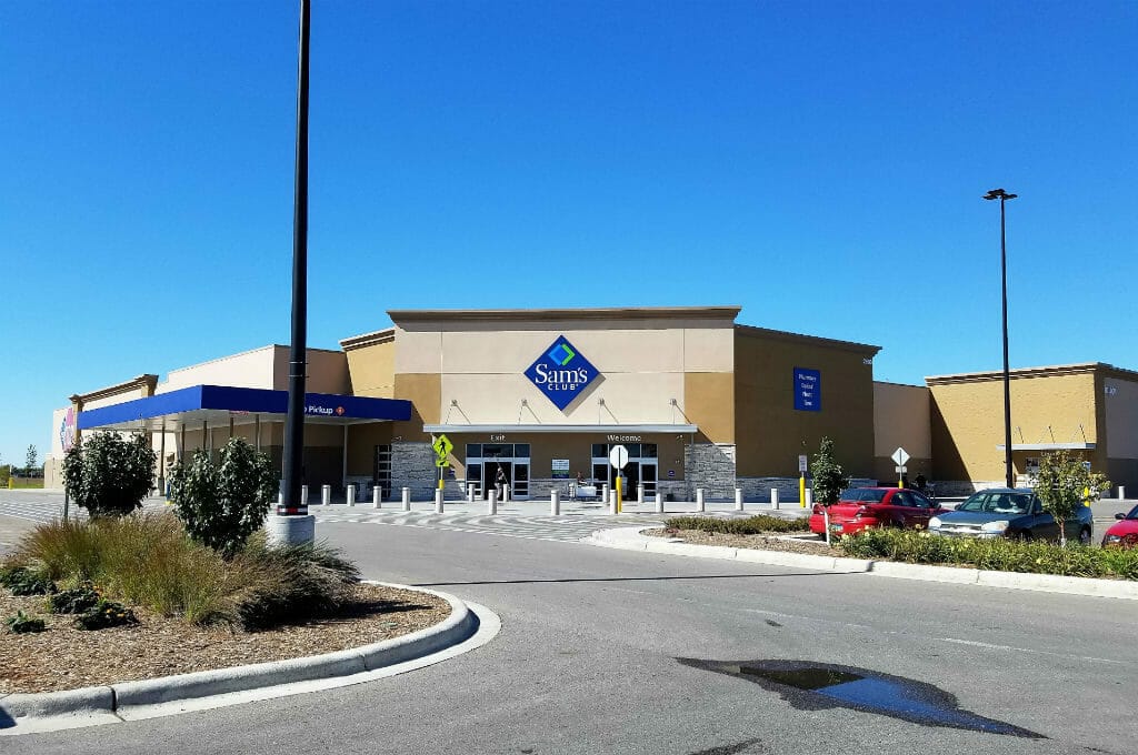 Further back view from parking lot of entrance to Sam's Club building.