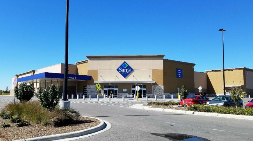 Further back view from parking lot of entrance to Sam's Club building.