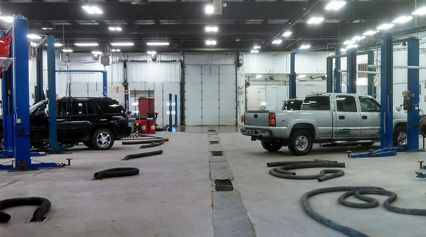 Service garage stations with vehicles throughout