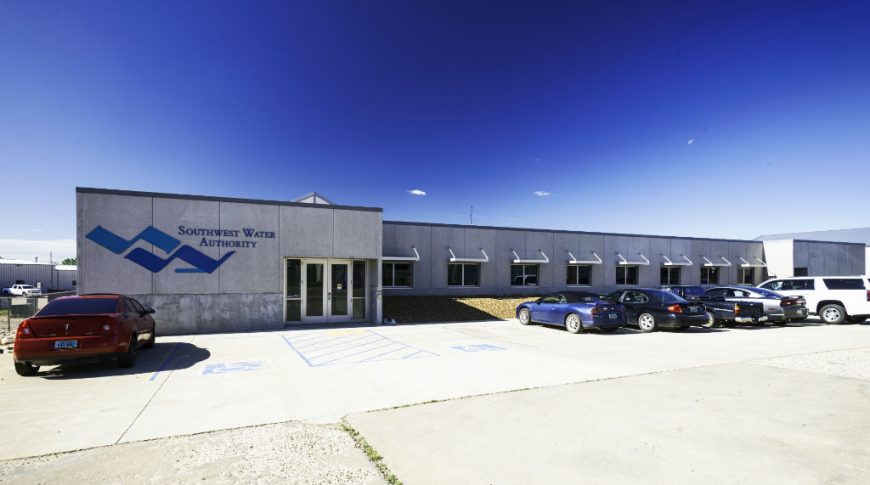 Southwest Water-P-Ext1-1024x680-Government Construction Exterior of Southwest Water Authority beige building with parking lot to the front