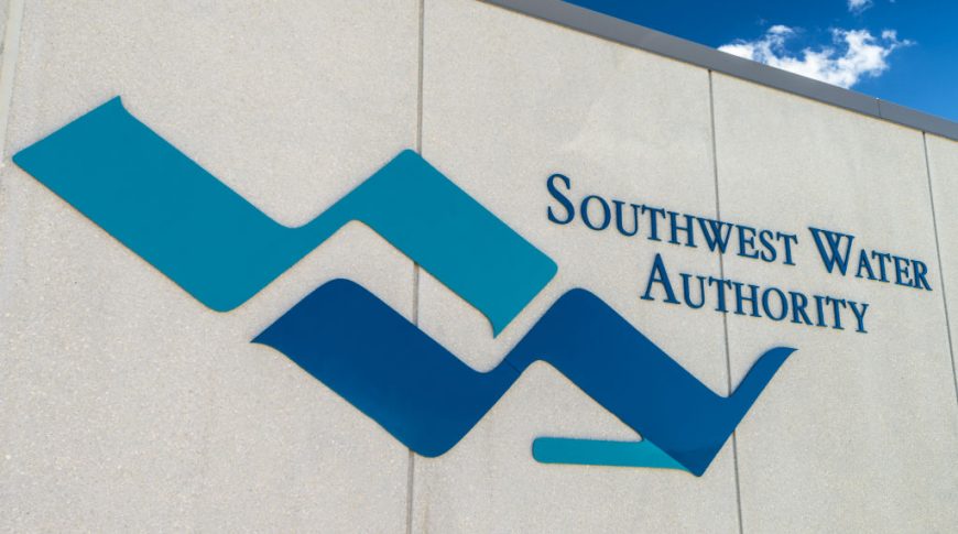 Southwest Water-P-Ext3-1024x680-Government Construction Exterior stucco beige wall with Southwest Water Authority blue logo
