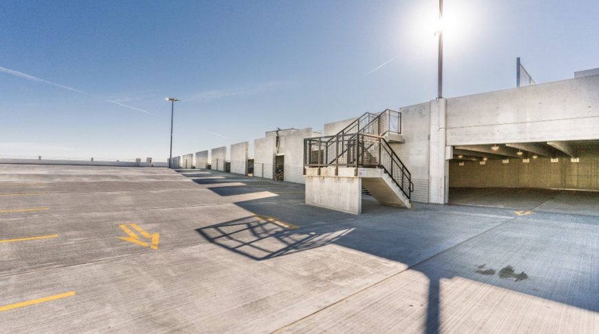 Top floor of the Mercantile parking ramp in downtown Fargo, ND on a sunny day with bright blue sky