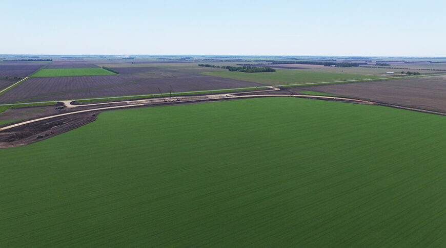 Aerial view of sitework for a new grain handling facility and rail loop track.