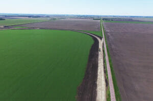 Aerial view of sitework for a new grain handling facility and rail loop track.