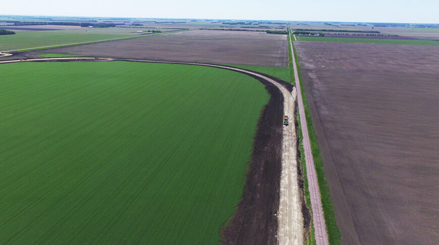 Aerial view of sitework for a new grain handling facility and rail loop track.