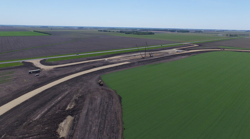 Aerial view of sitework for a new grain handling facility and rail loop track.