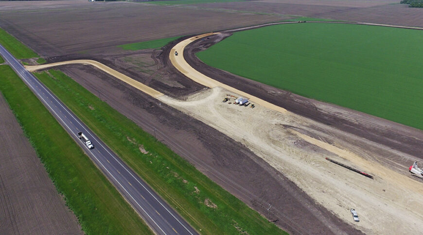 Aerial view of sitework for a new grain handling facility and rail loop track.