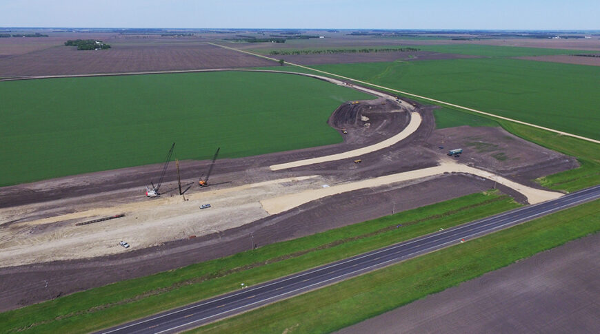 Aerial view of sitework for a new grain handling facility and rail loop track.