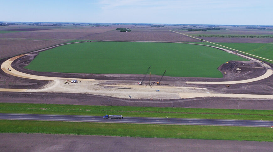 Aerial view of sitework for a new grain handling facility and rail loop track.