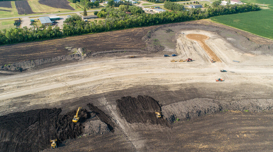 Aerial view of a residential development starting to take shape in a dirt field