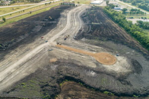 Aerial view of a residential development starting to take shape in a dirt field