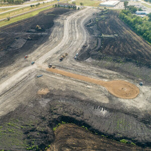Aerial view of a residential development starting to take shape in a dirt field