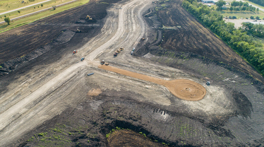 Aerial view of a residential development starting to take shape in a dirt field
