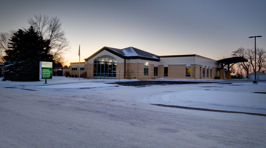 Outside of brick Marshall County Healthcare Center building on a snowy morning in Britton, SD