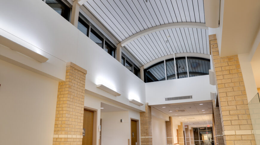 Grand Hallway with arched roof with windows surround.