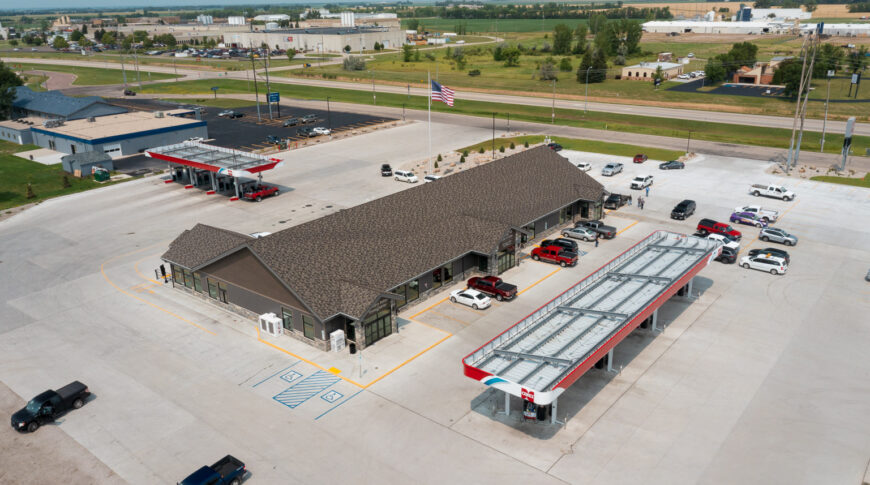 Aerial view of the roof the the Cenex C-Store and pump stations surrounded by concrete parking lot.