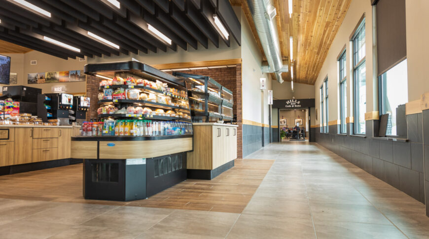 Low viewpoint at the entrance of Cenex C-Store looking into aisles of the premade sandwiches and juice and coffee bar to the back.