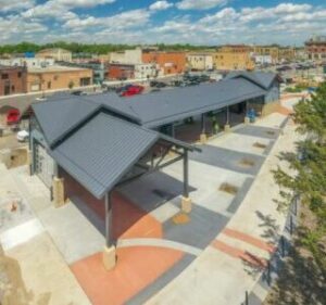 Drone aerial view of the Fergus Falls RiverFront pavilion during construction, from the south river's view featured in Prairie Business Magazine.