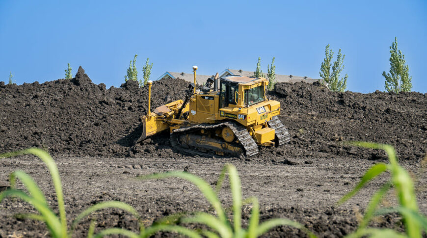 City of Horace-Civil Construction-Low Res-39 Bulldozer moving dirt to a pile in the foreground for the Rivers Edge Second Addition development in Horace, ND.