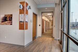 Look down Sanford Horace clinic hallway with patient rooms down on side.