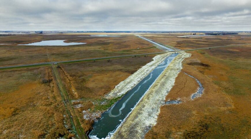View from a drone of a drainage ditch that has recently been excavated.