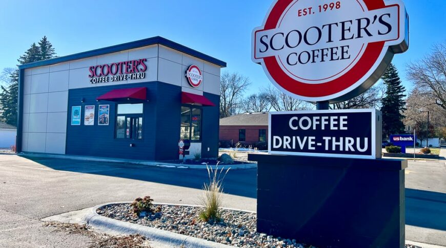 Business sign for Scooter's coffee with white, red, and black colors with the drive-thru building behind.