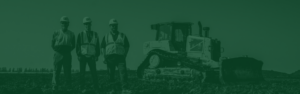 Green overlayed header image of three men posing for picture in dirt field with bulldozer in the background.