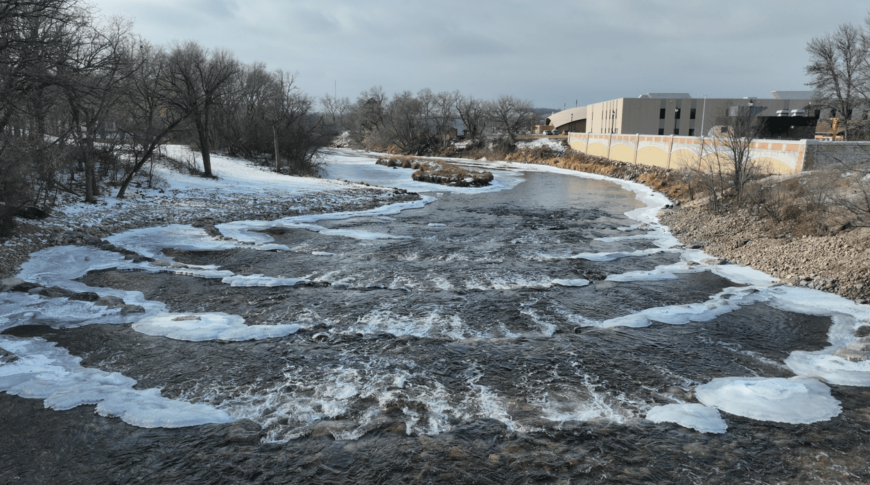 Slightly aerial view looking at the rows of rock weirs newly placed after dam demolition along the Sheyenne river in Valley City, ND.