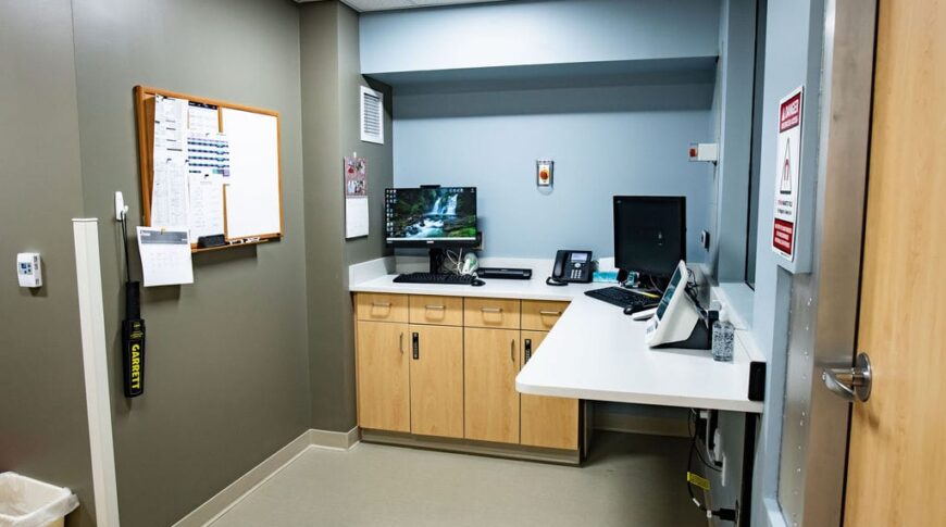 Control room of Marshall County Healthcare MRI with l-shaped countertops with two computer workstations.