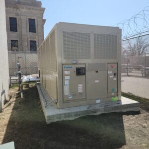 Daikin chiller unit on concrete block outside next to the Richland County Courthouse.