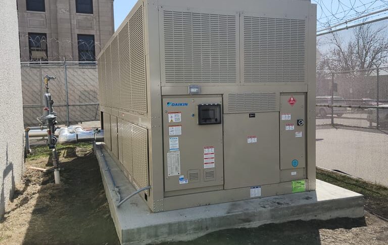 Daikin chiller unit on concrete block outside next to the Richland County Courthouse.