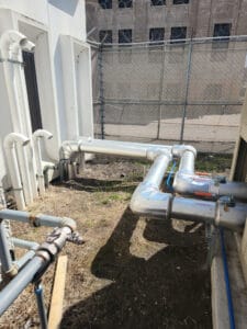 Tubing connecting the new chiller to the courthouse building.