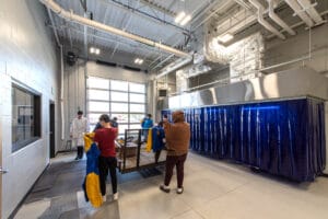 Dunseith CTE students dawning work shirts to get hands-on experience in specialty lab. Photo by Icon Architectural Group.