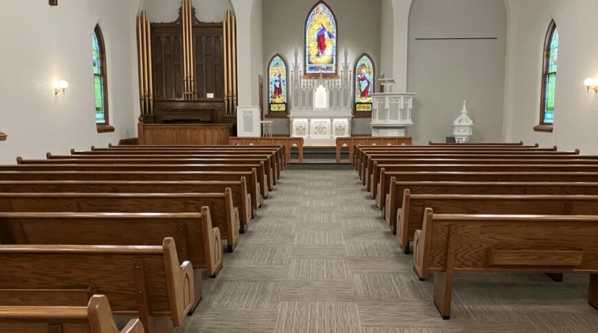 Forward looking view of church pulpit after the refresh, with new carpeting and paint.