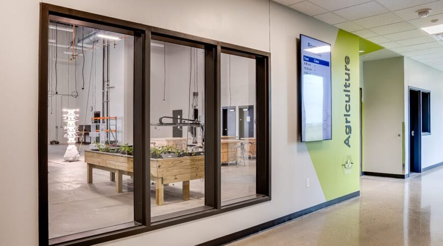 Hallway view looking in via tri-paned window to the agriculture workshop at the NDSCS Career Innovation center.
