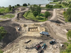 Aerial construction progress of the Delagoon Campground in Fergus Falls. The ground is mostly dirt and gravel.