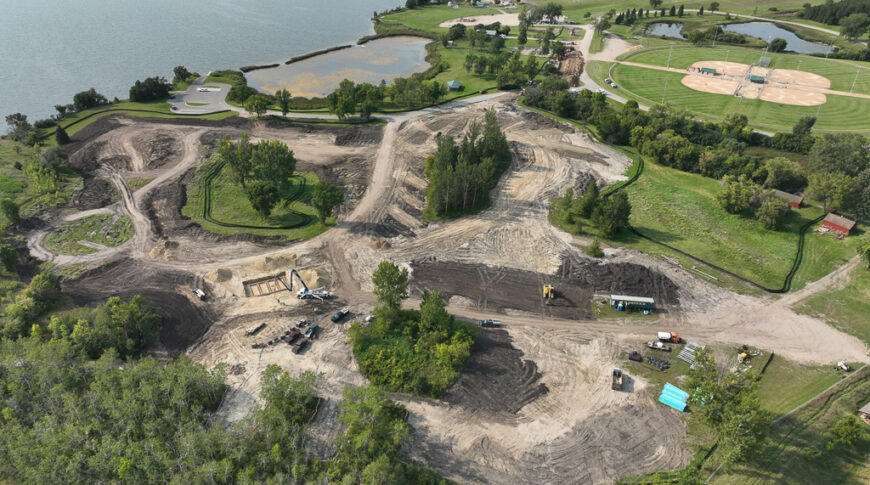 Aerial construction progress of the Delagoon Campground in Fergus Falls. The ground is mostly dirt and gravel.
