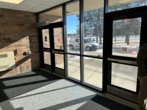Before view from the carpeted vestibule of the activities center.