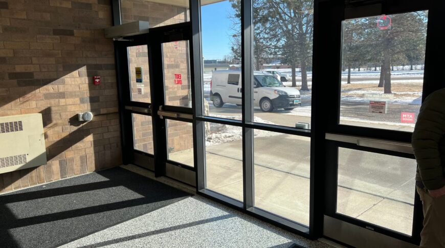 Before view from the carpeted vestibule of the activities center.