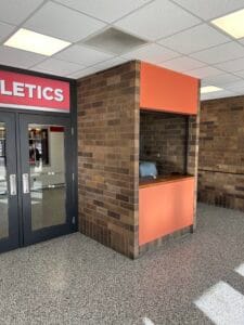 Before view of the ticket booth in the vestibule at the NDSCS Blikre Activities Center entrance.