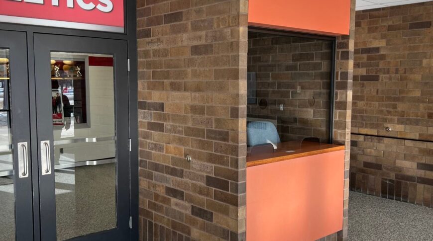 Before view of the ticket booth in the vestibule at the NDSCS Blikre Activities Center entrance.