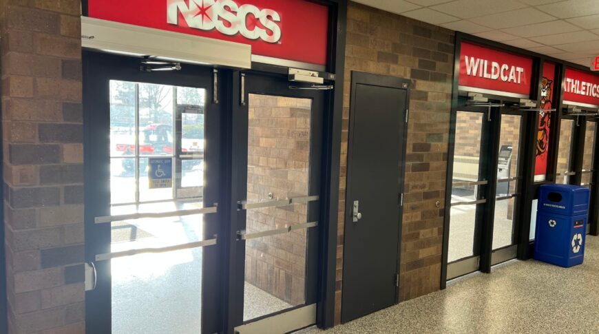 Before image of the NDSCS Blikre Activities Center Entrance Doors from the inside of the building.
