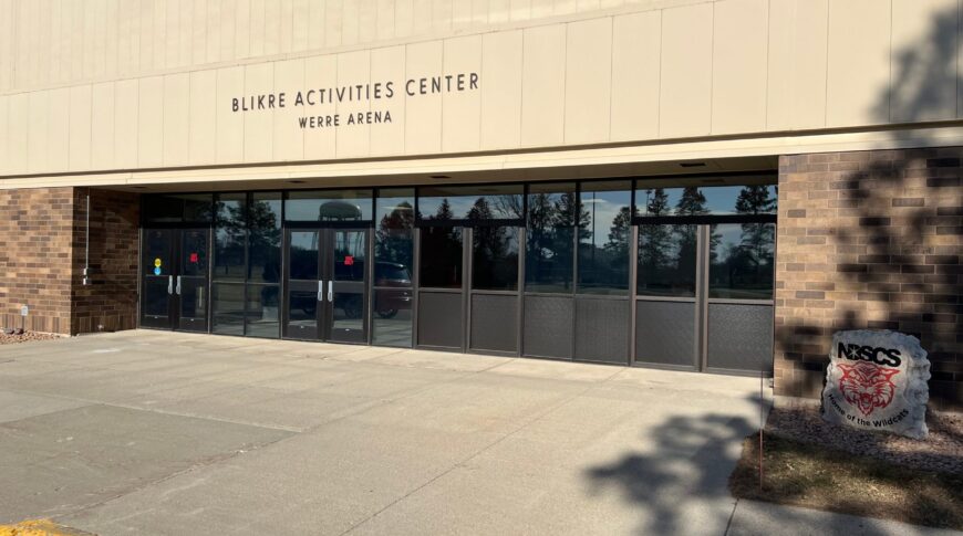 External view of the Blikre Activities Center entrance after converting two of the four double doors sets into a conference room.