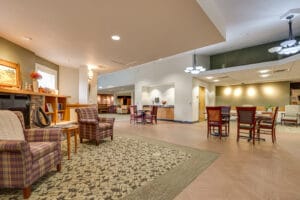 Redone dining room flooring at PioneerCare Center in Fergus Falls, flanked by fireplace seating area to the right.