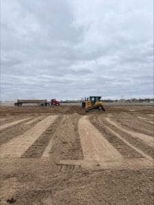 Bulldozer pushes yellow soil on the site of the new Infinity Center in Breckenridge, MN