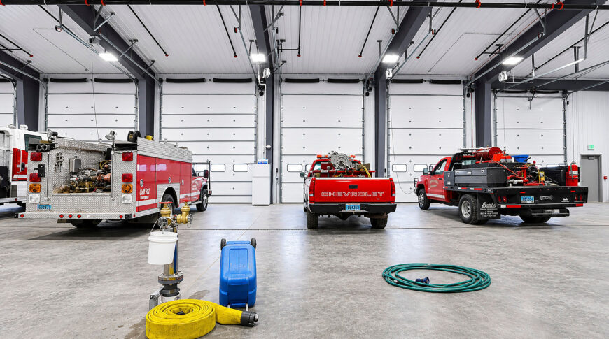 Bottineau Fire Hall - Low Res (4) Inside viewpoint looking towards 6 closed truck bays at the newly built Bottineau Fire Hall.