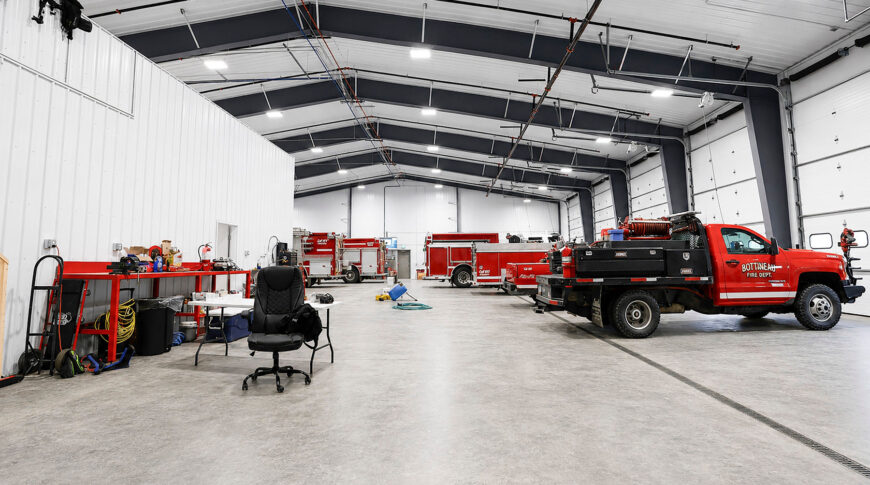 Bottineau Fire Hall - Low Res (6) Interior view of Bottineau Fire Department newly built metal building with 6 truck bays to the right and an enclosed portion to the left.