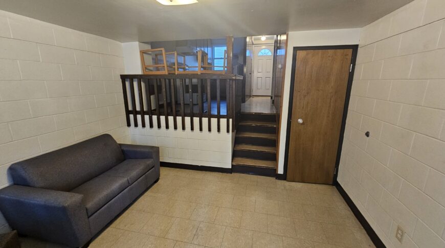 Previous view from sunken living room into dining area through railing.
